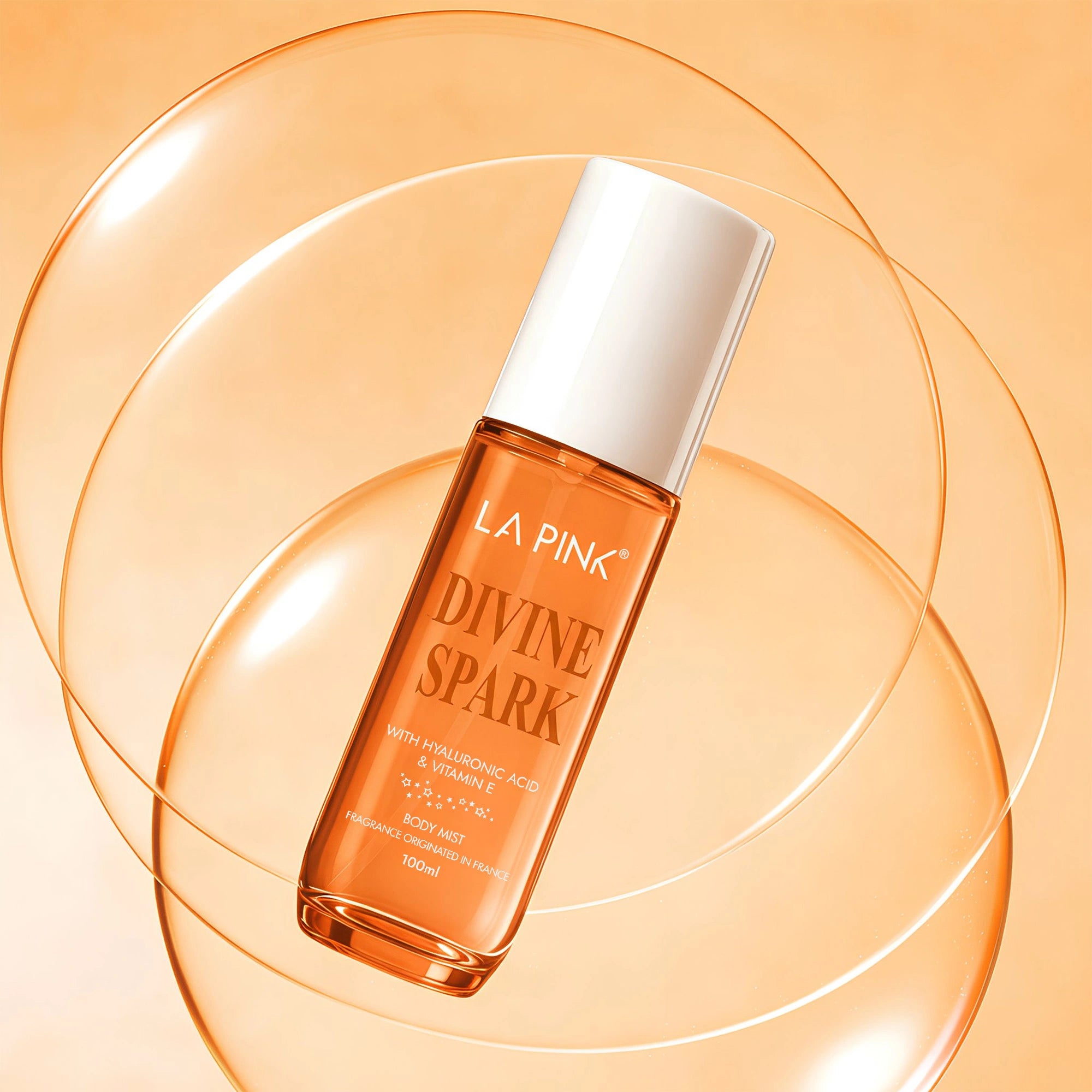 La Pink Divine Spark skincare product on an orange background