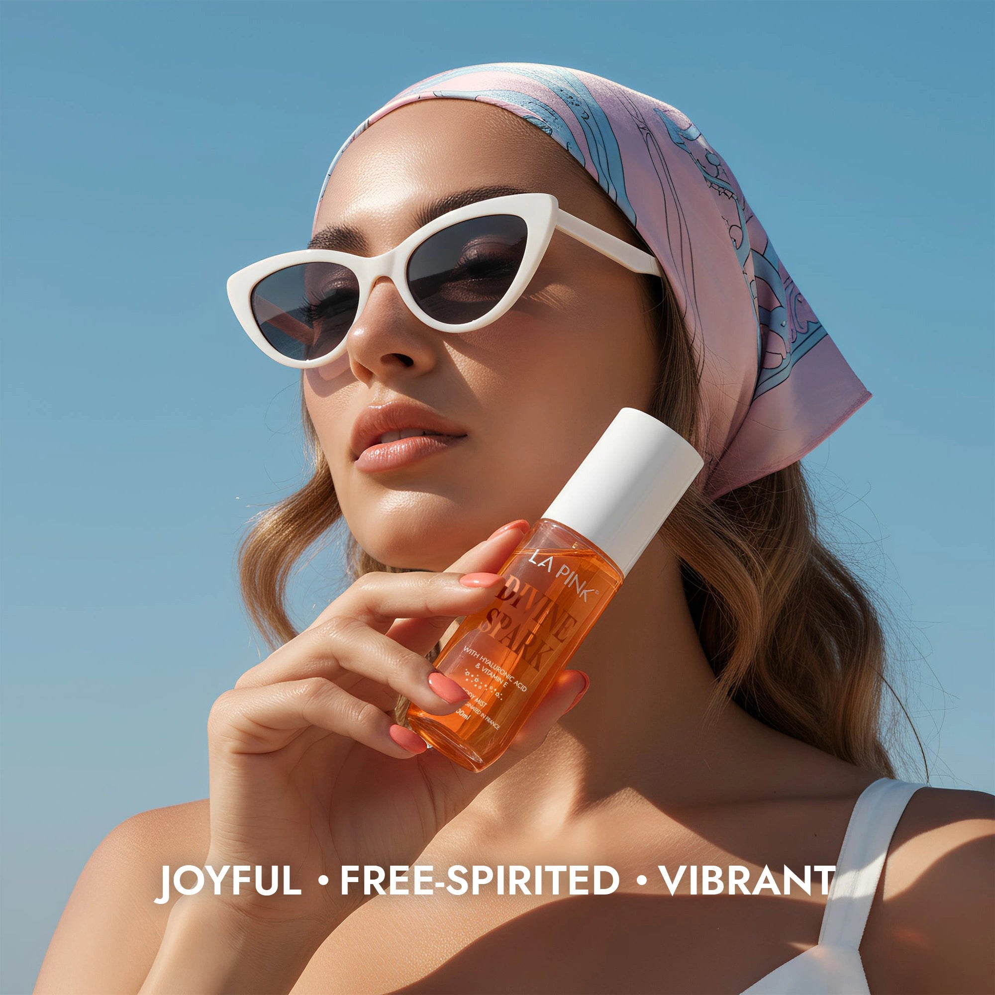 Woman holding a bottle of La Plage de Paris sunscreen with a blue sky background