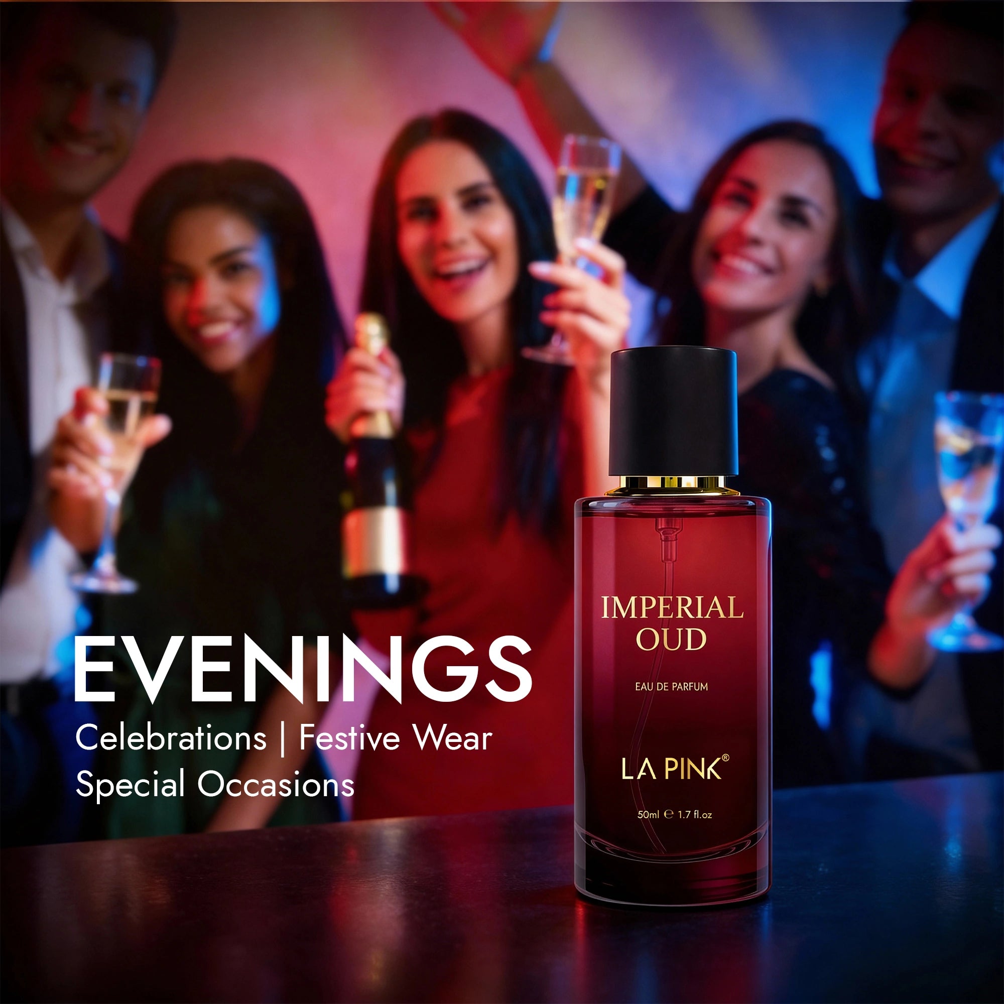 Bottle of La Pink Imperial Oud perfume with people celebrating in the background