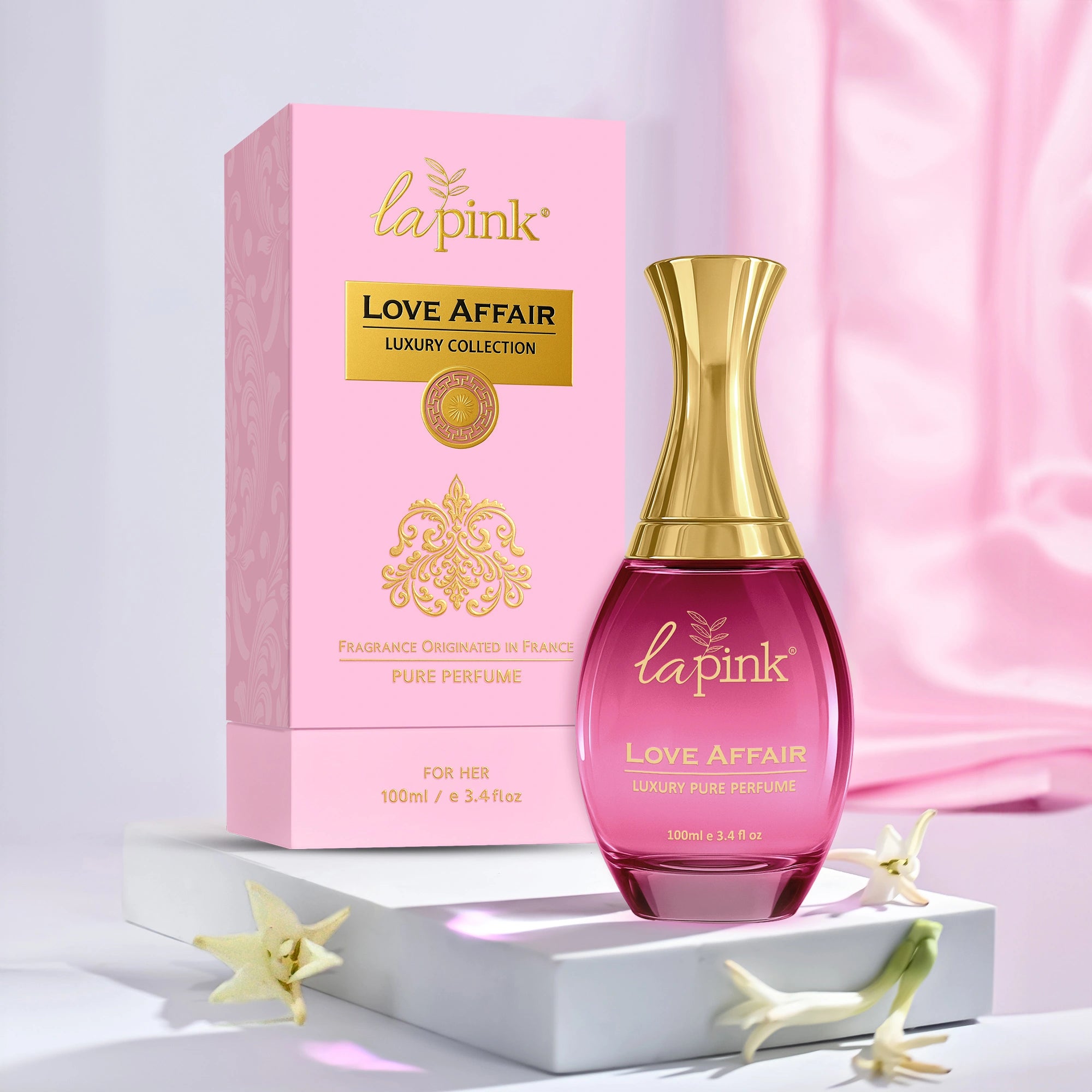 La Pink Love Affair perfume bottle and packaging on a light pink background