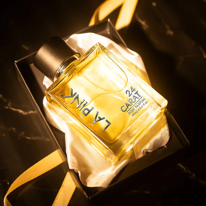 A rectangular glass perfume bottle filled with golden-yellow liquid, labeled &