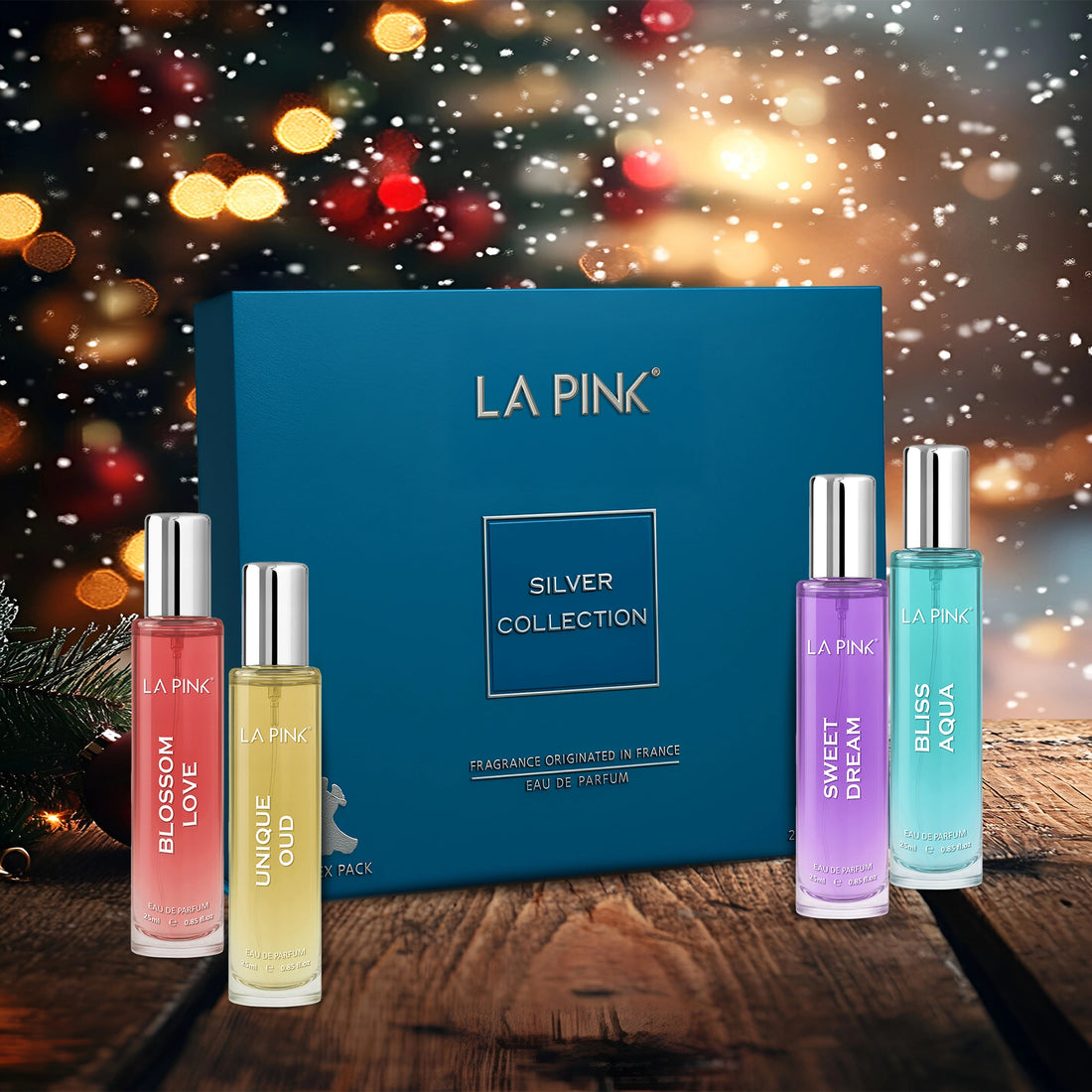 LA Pink Silver Collection perfume set with a festive background