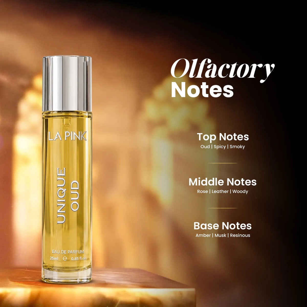 A bottle of LA PINK UNIQUE OUD Eau de Parfum stands on a wooden surface against a warm, glowing background. To the right, text reads &