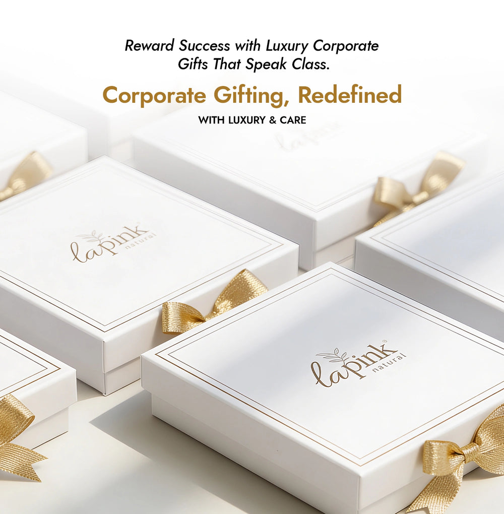 White gift boxes with gold ribbons and 'La Pink' branding on a white background.