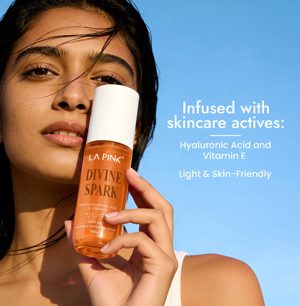 Woman holding a bottle of 'La Pink Divine Spark' skincare product against a blue sky.