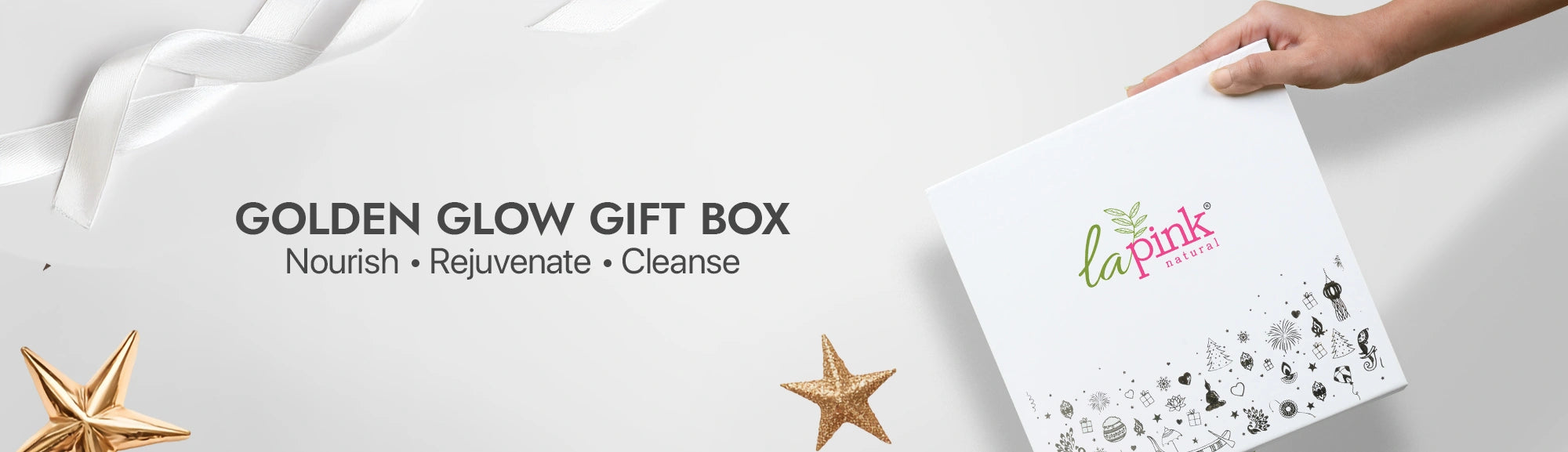 La Pink Golden Glow Gift Box with decorative stars on a white background