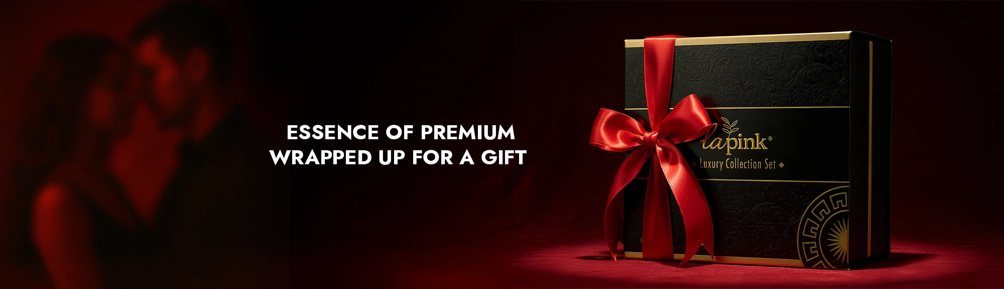 Gift box with a red ribbon on a dark background, featuring the brand 'ca'pink'.