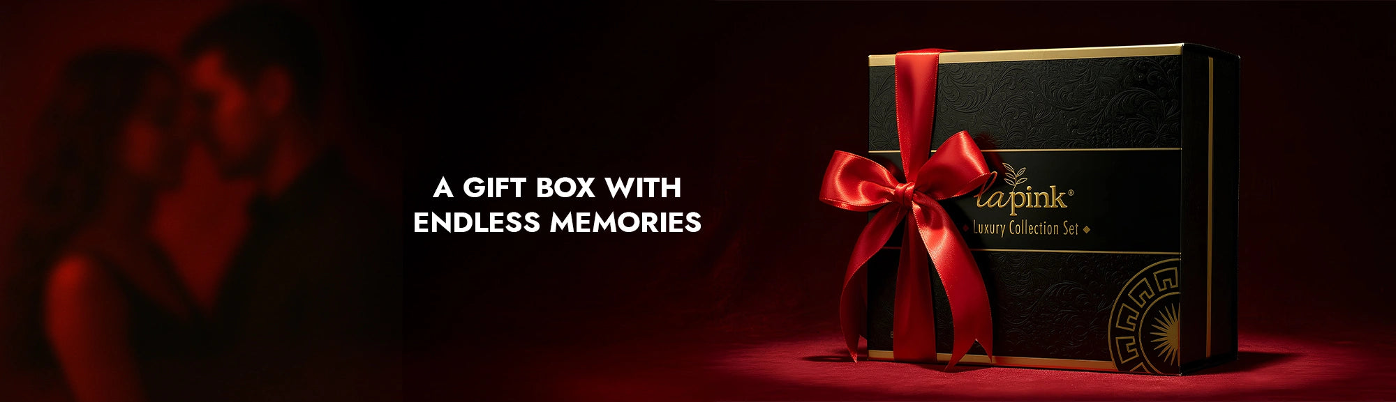 Gift box with red ribbon and 'cap pink' branding on a dark background