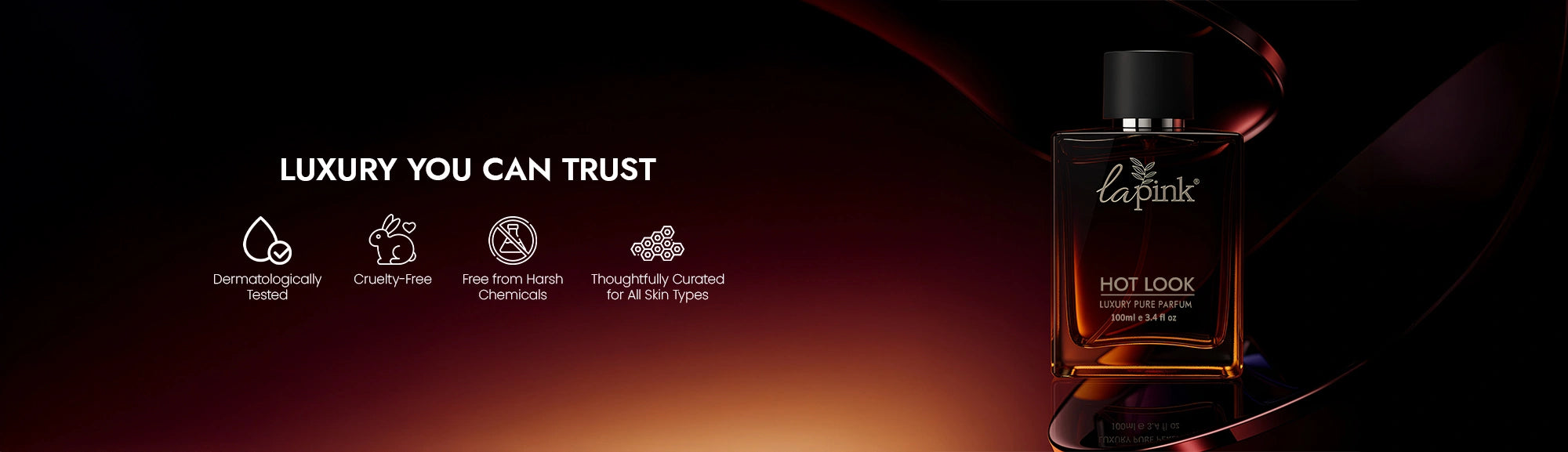 La Pink Hot Look perfume bottle on a dark background with brand promises listed.