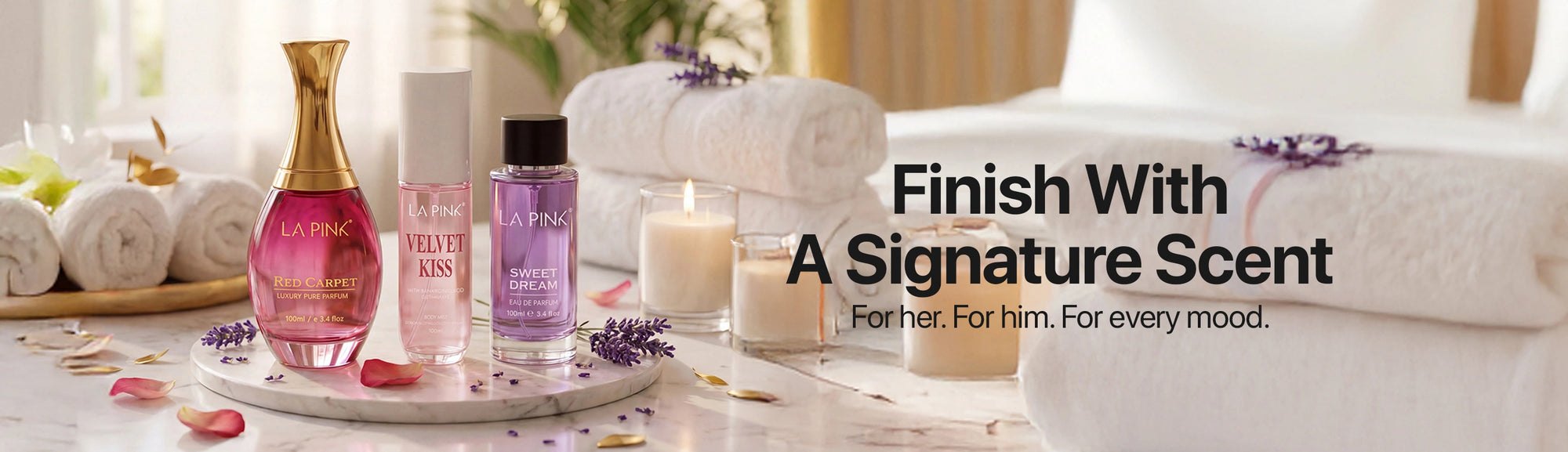 Bottle of perfume and candles on a table with spa towels in the background, promoting a signature scent.