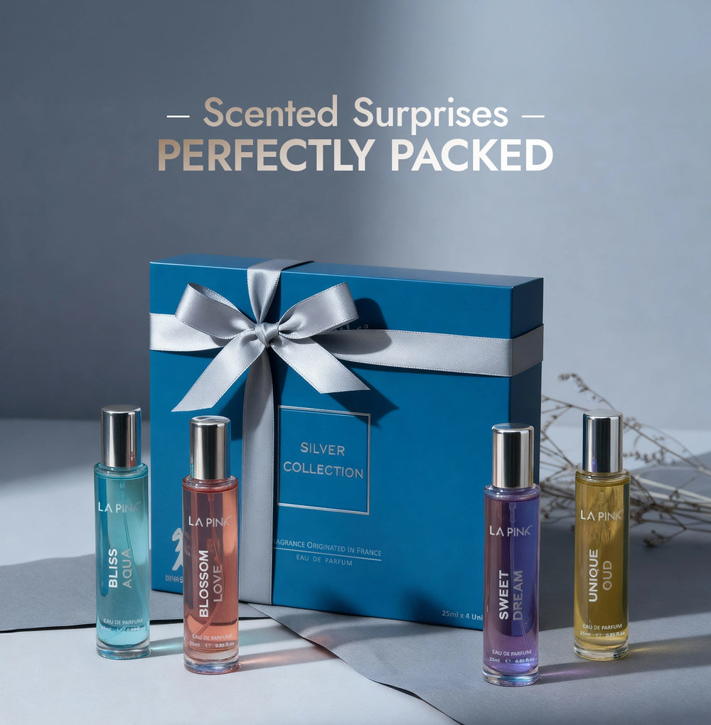 Set of perfume bottles with a blue gift box on a gray background
